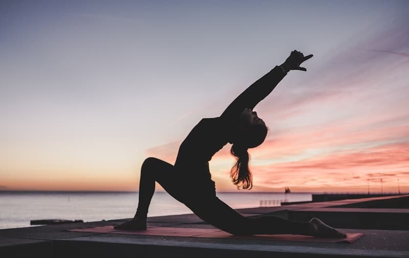 Woman doing yoga outdoors